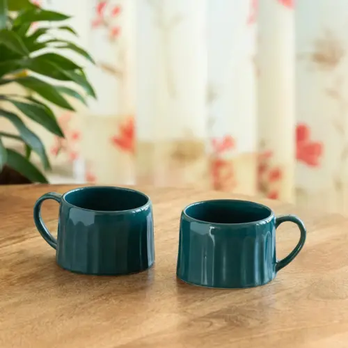 ExclusiveLane 'Aqua' Ceramic Tea And Coffee Mugs (Set of 2, 250 ML, Microwave Safe, Hand-Embossed) ExclusiveLane 'Aqua' Ceramic Tea And Coffee Mugs (Set of 2, 250 ML, Microwave Safe, Hand-Embossed)