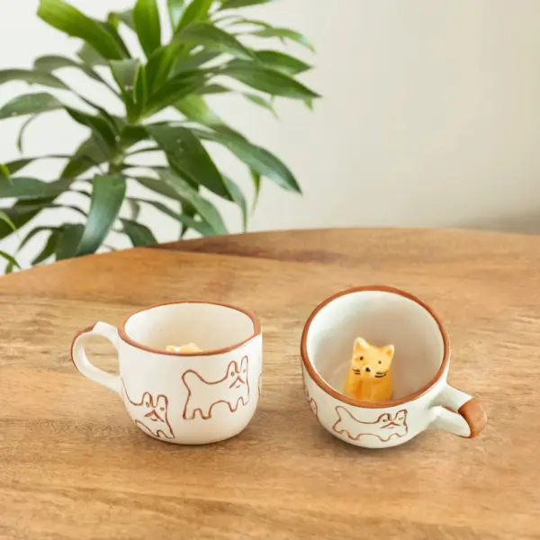 ExclusiveLane 'Cute Cat Suprise' Ceramic Tea And Coffee Mugs (Set of 2, 240 ML, Microwave Safe, Hand-Embossed) ExclusiveLane 'Cute Cat Suprise' Ceramic Tea And Coffee Mugs (Set of 2, 240 ML, Microwave Safe, Hand-Embossed)