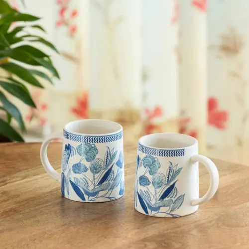 ExclusiveLane 'Floral Bliss' Ceramic Tea And Coffee Mugs (Set of 2, 300 ML, Microwave Safe, Handcrafted) ExclusiveLane 'Floral Bliss' Ceramic Tea And Coffee Mugs (Set of 2, 300 ML, Microwave Safe, Handcrafted)