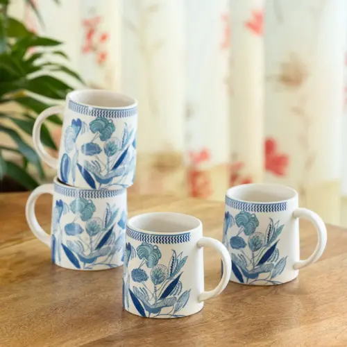 ExclusiveLane 'Floral Bliss' Ceramic Tea And Coffee Mugs (Set of 4, 300 ML, Microwave Safe, Handcrafted) ExclusiveLane 'Floral Bliss' Ceramic Tea And Coffee Mugs (Set of 4, 300 ML, Microwave Safe, Handcrafted)