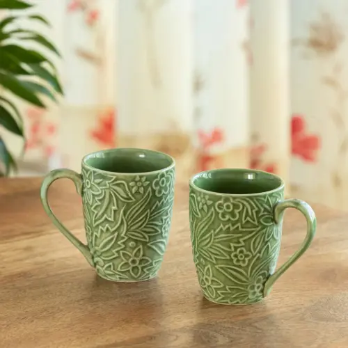 ExclusiveLane 'Green Flora' Ceramic Tea And Coffee Mugs (Set of 2, 290 ML, Microwave Safe, Hand-Embossed) ExclusiveLane 'Green Flora' Ceramic Tea And Coffee Mugs (Set of 2, 290 ML, Microwave Safe, Hand-Embossed)