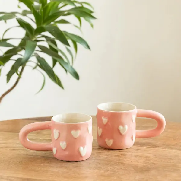 ExclusiveLane 'Heart Bump' Ceramic Tea And Coffee Mugs (Set of 2, 260 ML, Microwave Safe, Hand-Embossed) ExclusiveLane 'Heart Bump' Ceramic Tea And Coffee Mugs (Set of 2, 260 ML, Microwave Safe, Hand-Embossed)