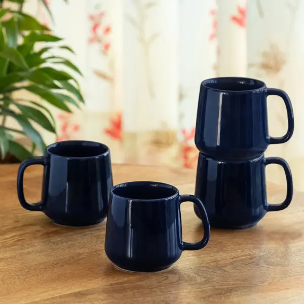 ExclusiveLane 'Mariana Blues' Ceramic Tea & Coffee Mugs (Set of 4, 340 ML, Microwave Safe, Hand Glazed) ExclusiveLane 'Mariana Blues' Ceramic Tea & Coffee Mugs (Set of 4, 340 ML, Microwave Safe, Hand Glazed)