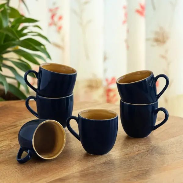 ExclusiveLane 'Mariana Blues' Ceramic Tea Cups (Set of 6, 190 ML, Microwave Safe, Hand Glazed) ExclusiveLane 'Mariana Blues' Ceramic Tea Cups (Set of 6, 190 ML, Microwave Safe, Hand Glazed)