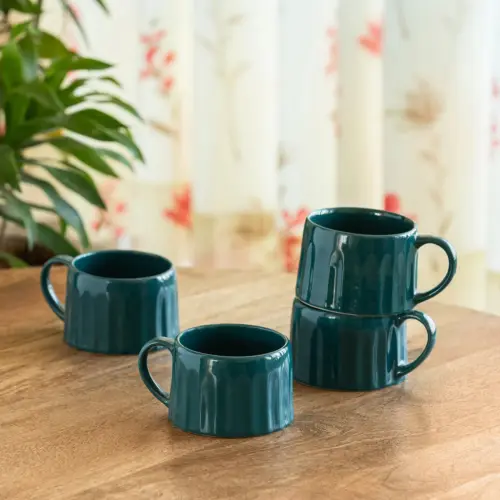 ExclusiveLane 'Mermaid Ribbed' Ceramic Tea And Coffee Mugs (Set of 4, 250 ML, Microwave Safe, Hand-Embossed) ExclusiveLane 'Mermaid Ribbed' Ceramic Tea And Coffee Mugs (Set of 4, 250 ML, Microwave Safe, Hand-Embossed)