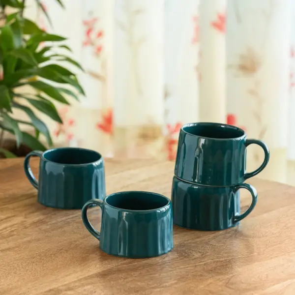 ExclusiveLane 'Mermaid Ribbed' Ceramic Tea And Coffee Mugs (Set of 4, 250 ML, Microwave Safe, Hand-Embossed) ExclusiveLane 'Mermaid Ribbed' Ceramic Tea And Coffee Mugs (Set of 4, 250 ML, Microwave Safe, Hand-Embossed)