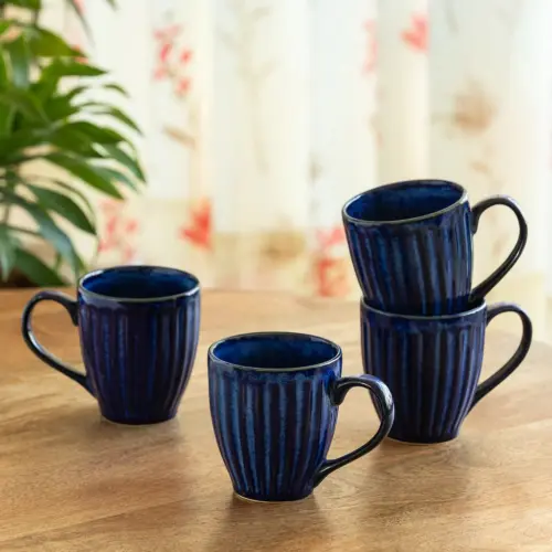 ExclusiveLane 'Midnight Ribbed' Ceramic Tea And Coffee Mugs (Set of 4, 260 ML, Microwave Safe, Hand-Embossed) ExclusiveLane 'Midnight Ribbed' Ceramic Tea And Coffee Mugs (Set of 4, 260 ML, Microwave Safe, Hand-Embossed)