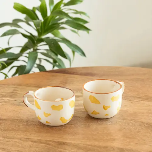 ExclusiveLane 'Peek-A-Boo' Ceramic Tea And Coffee Mugs (Set of 2, 200 ML, Microwave Safe, Hand-Embossed) ExclusiveLane 'Peek-A-Boo' Ceramic Tea And Coffee Mugs (Set of 2, 200 ML, Microwave Safe, Hand-Embossed)
