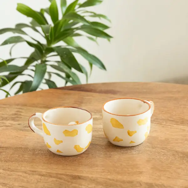 ExclusiveLane 'Peek-A-Boo' Ceramic Tea And Coffee Mugs (Set of 2, 200 ML, Microwave Safe, Hand-Embossed) ExclusiveLane 'Peek-A-Boo' Ceramic Tea And Coffee Mugs (Set of 2, 200 ML, Microwave Safe, Hand-Embossed)