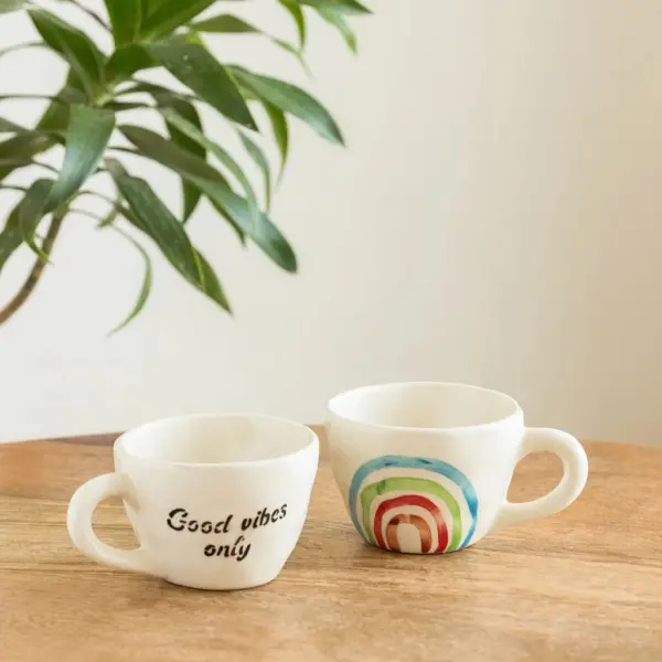 ExclusiveLane 'Rainbow Bright' Ceramic Tea And Coffee Mugs (Set of 2, 220 ML, Microwave Safe, Hand-Painted) ExclusiveLane 'Rainbow Bright' Ceramic Tea And Coffee Mugs (Set of 2, 220 ML, Microwave Safe, Hand-Painted)
