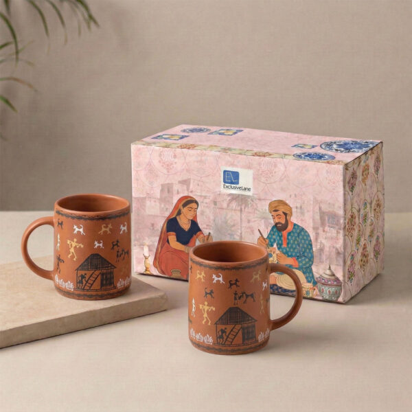 ExclusiveLane 'Warli Village Tales' Ceramic Tea & Coffee Mugs (Set of 2, 300 ML, Microwave Safe, Handcrafted) ExclusiveLane 'Warli Village Tales' Ceramic Tea & Coffee Mugs (Set of 2, 300 ML, Microwave Safe, Handcrafted)